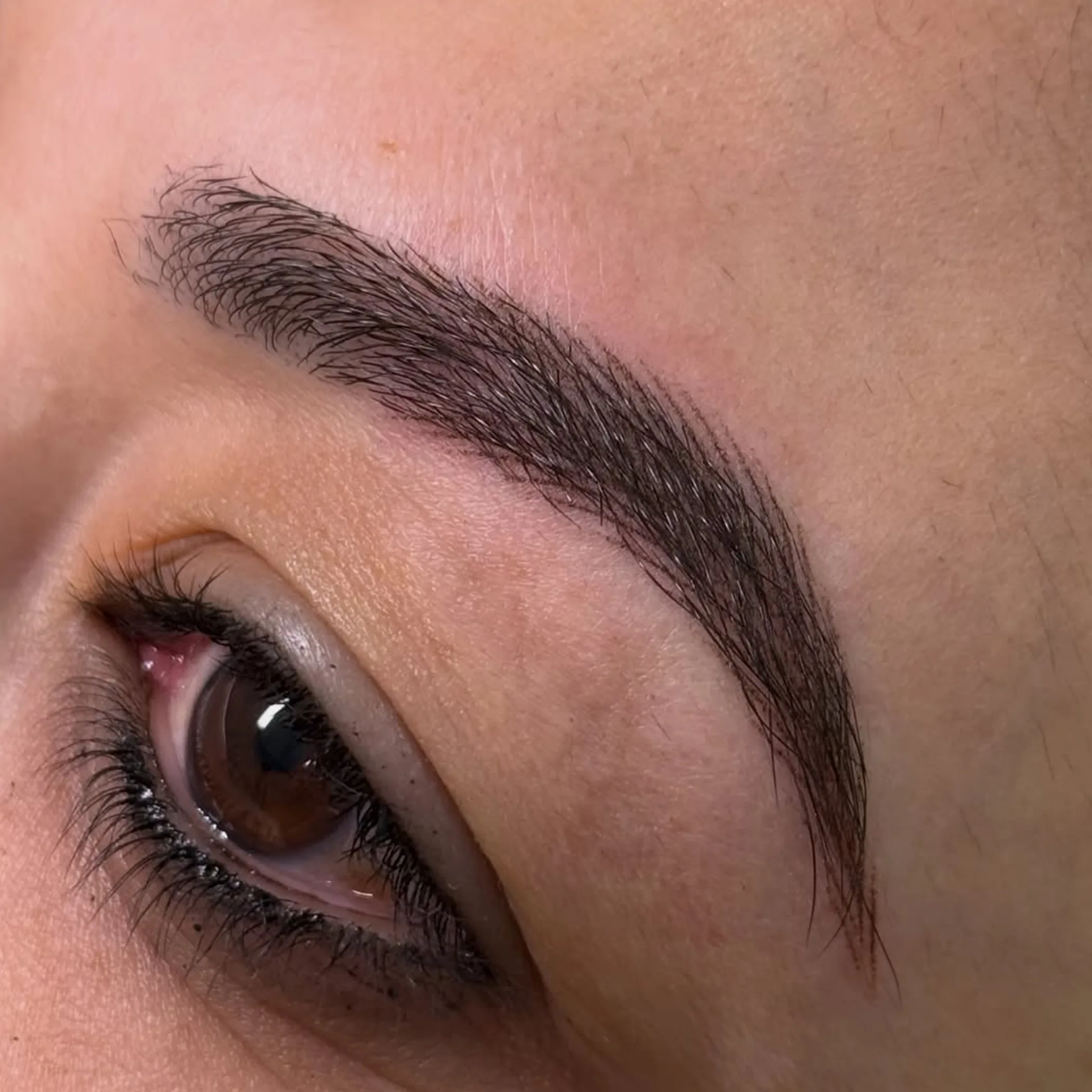 close-up of eyebrow cosmetic tattoo healing
